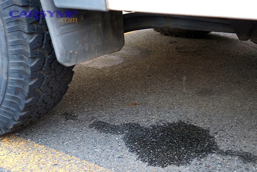 How can you confirm the drain is clogged without disassembly?