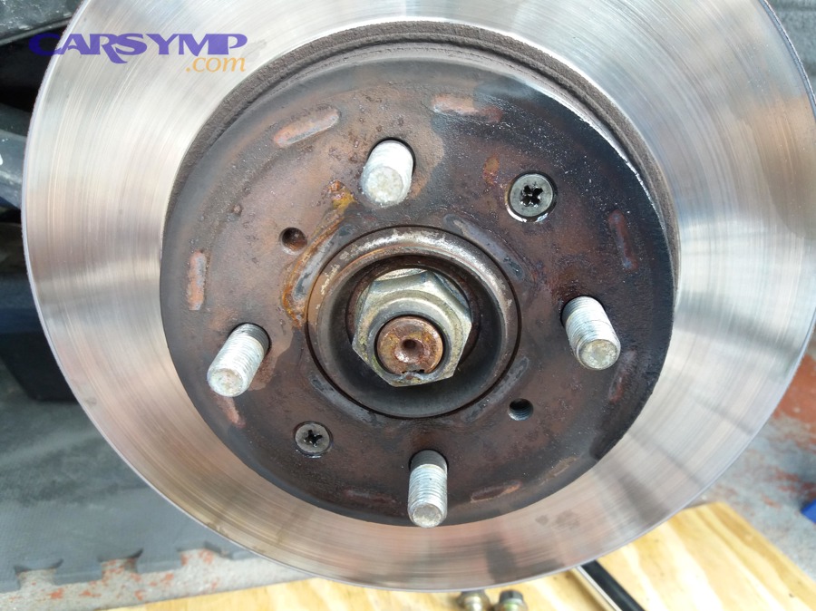 Is it safe to keep driving when a rotor is rust-stuck or a screw is damaged?