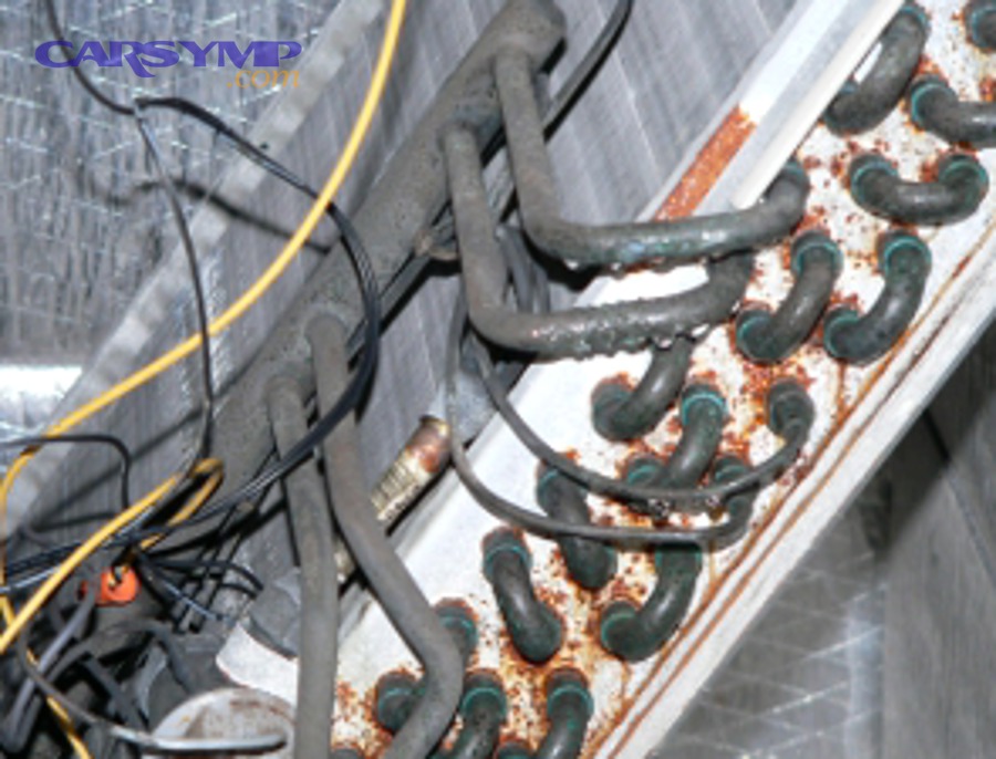 How do you diagnose a clogged A/C drain line or wet evaporator case?