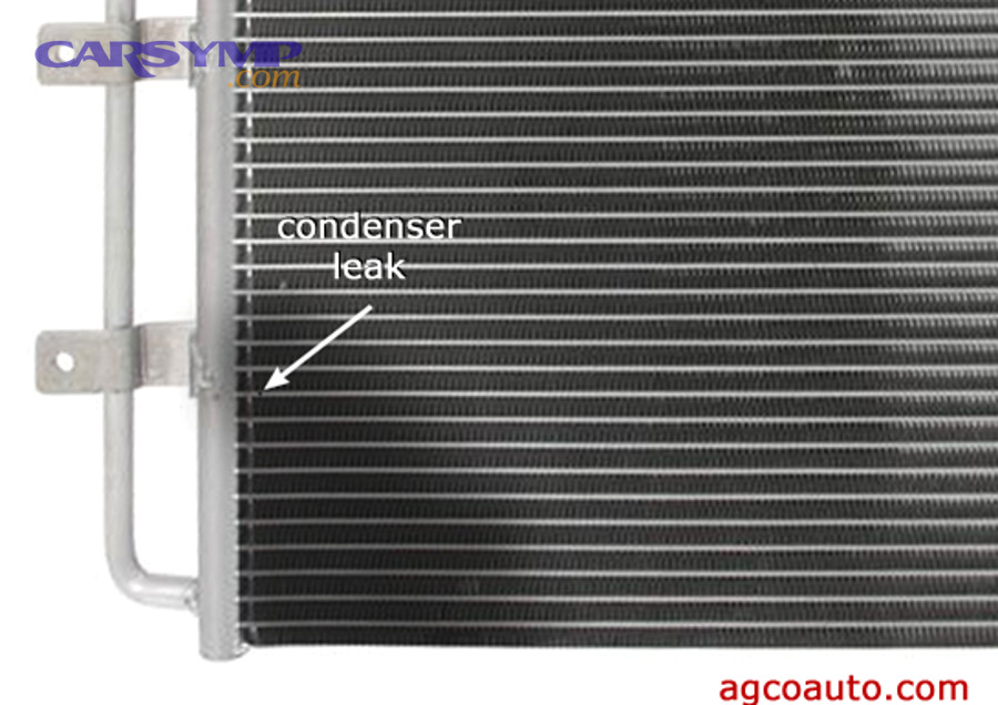 Which AC condenser leak symptoms are most noticeable while driving?
