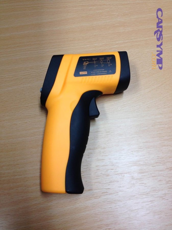 yellow black infrared thermometer in side view