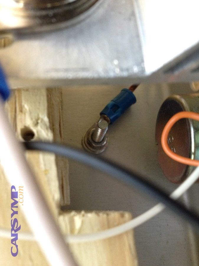 Ground wire attached to chassis demonstrating grounding point in electrical system