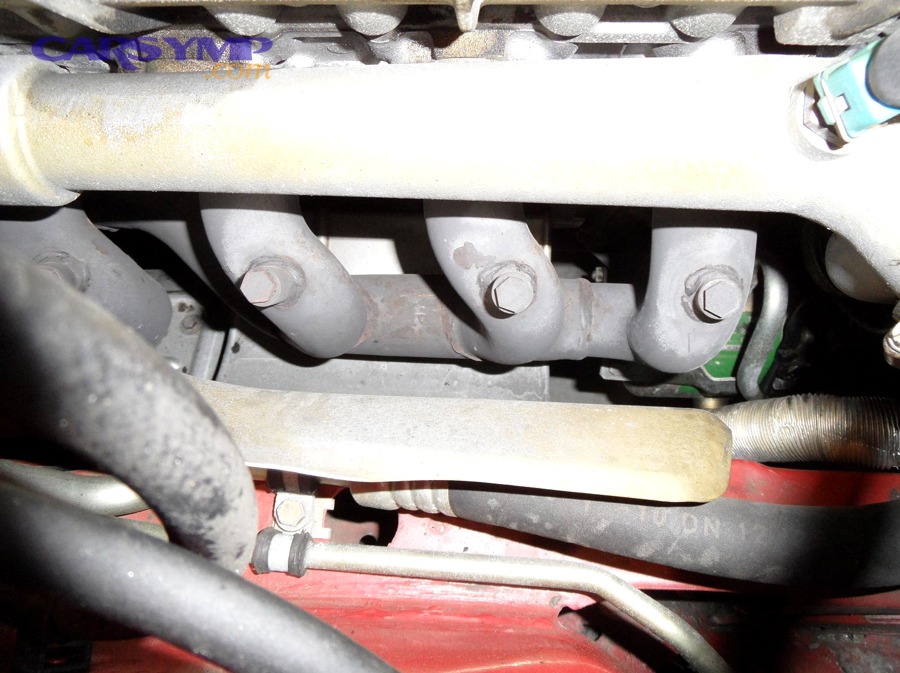 How can you verify the oil is landing on the exhaust and not somewhere else?