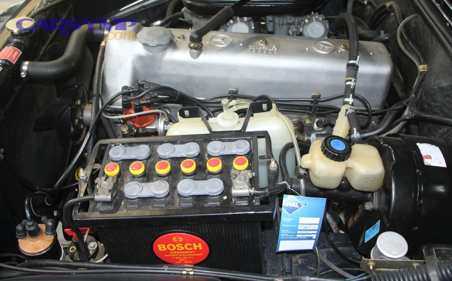 How do you install the new battery and tighten terminals correctly?