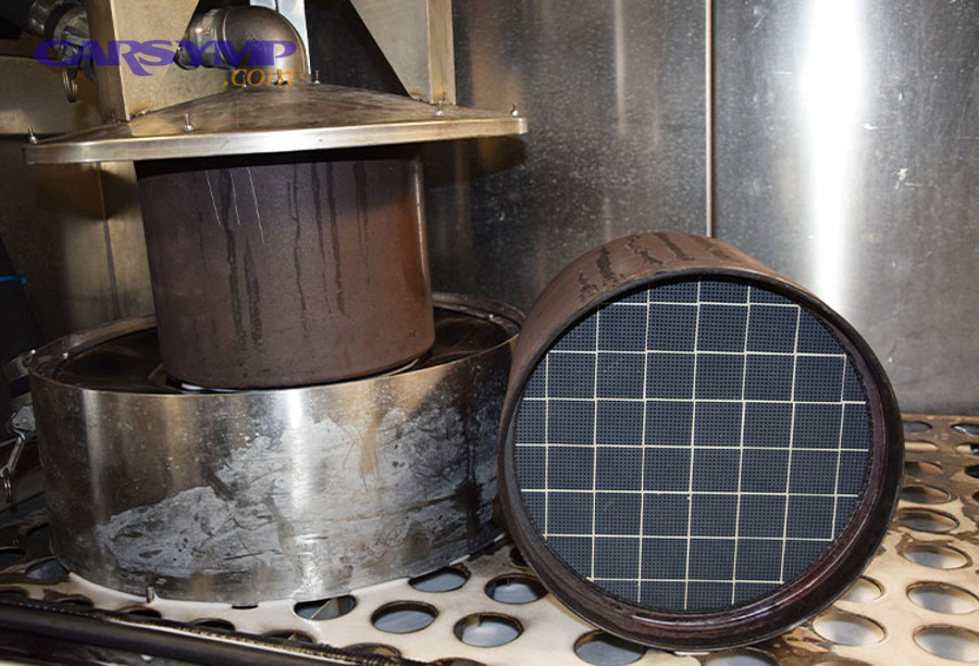 Diesel exhaust outlet illustrating soot and heat-related exhaust conditions