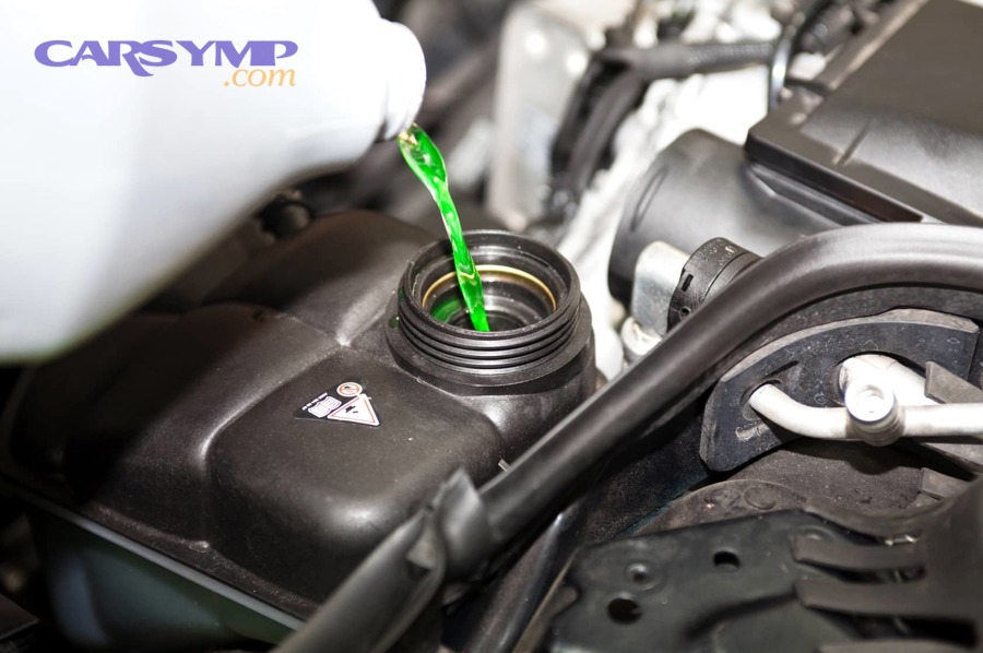 Sludgy contaminated coolant visible in reservoir indicating flush may be needed