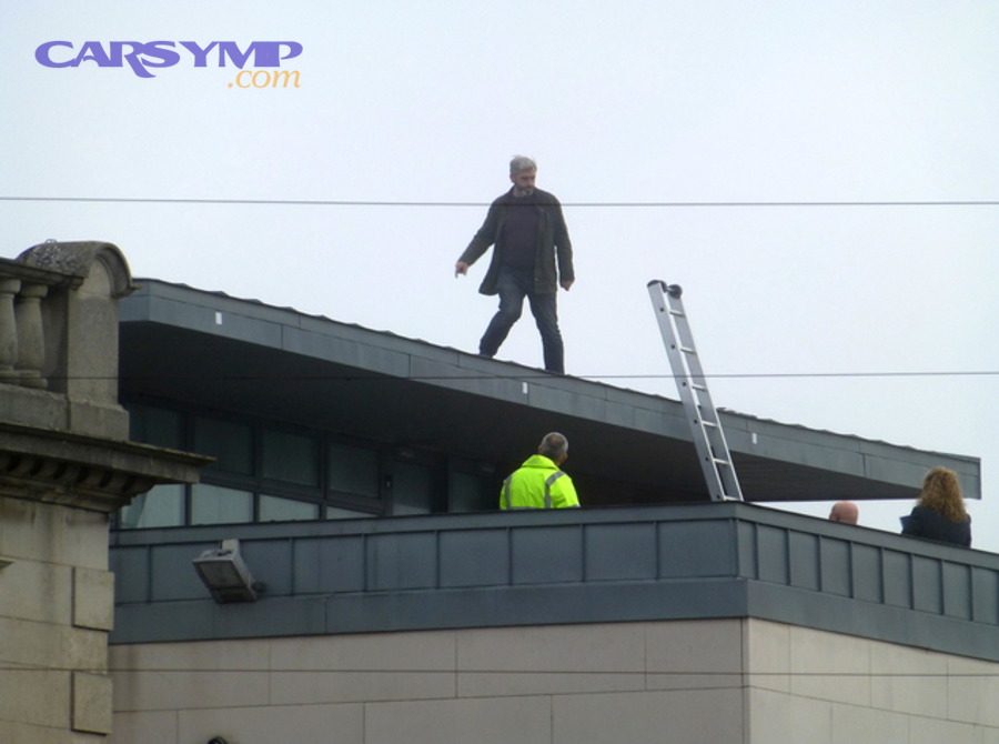 Technician performing a roof inspection