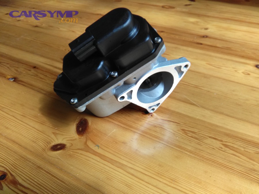 Photo of an EGR valve assembly on a workbench