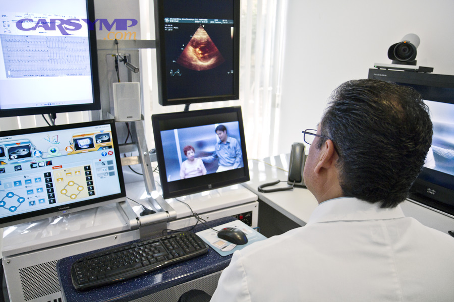 Telemedicine consult showing a virtual second opinion with shared charts and scans