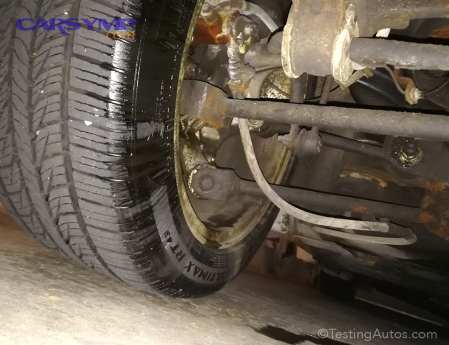 Brake caliper fluid leak near wheel