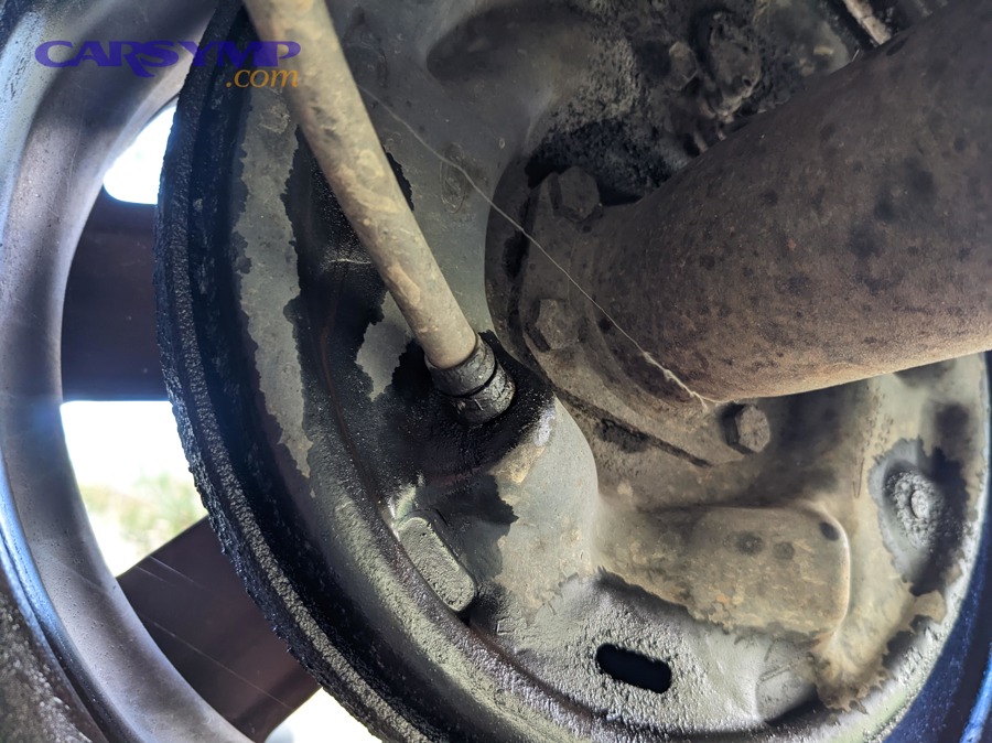 Brake fluid leak at a wheel: caliper vs hose vs line