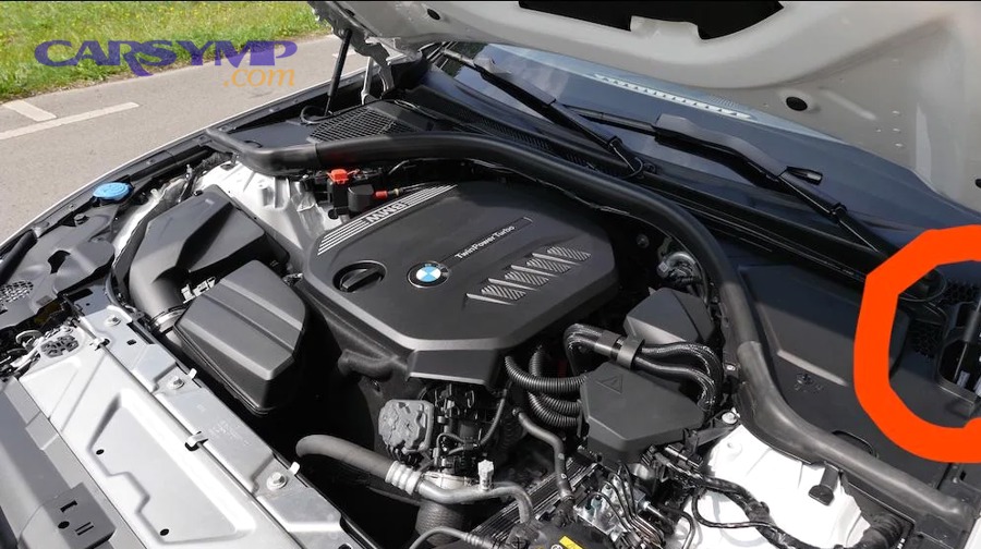 Coolant leak residue near hose connection on radiator or thermostat housing