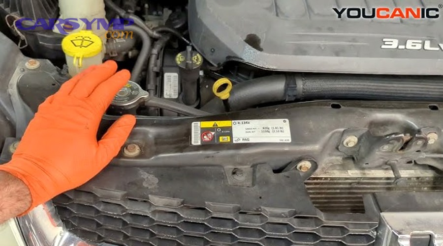 Car engine coolant thermostat close-up used for thermostat checks during service