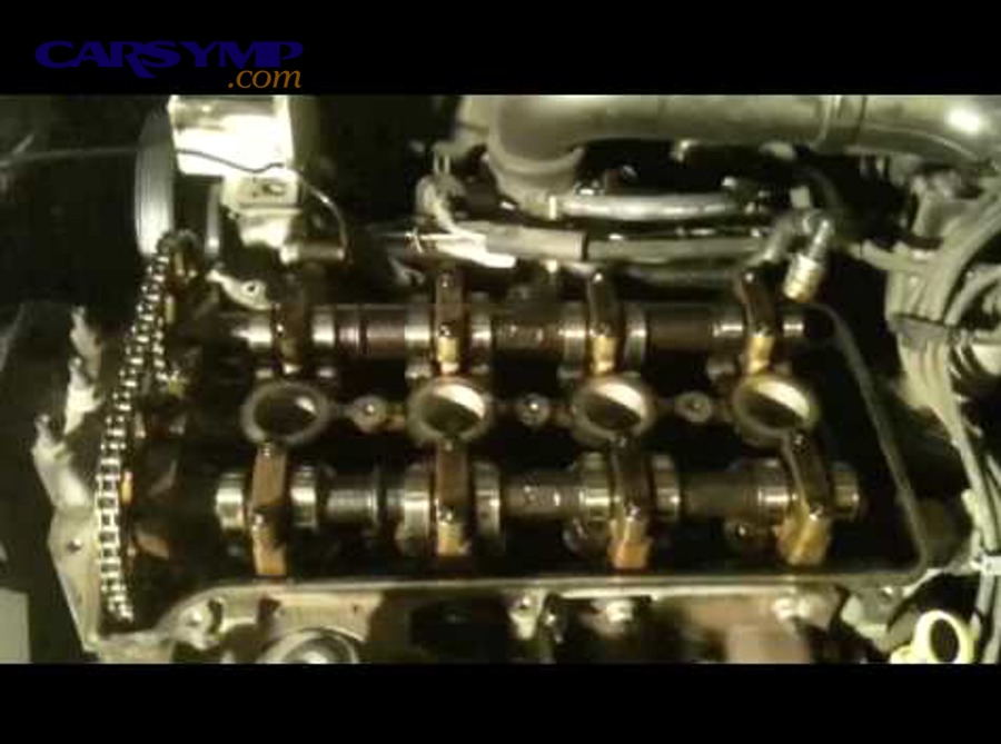 Close-up of an EGR valve showing carbon buildup on a diesel engine