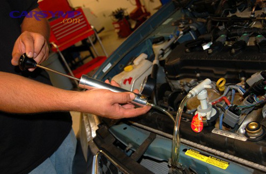 Hand pump used for pressure testing with a gauge