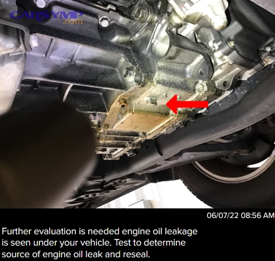 Why does a burnt-oil odor show up near the car?