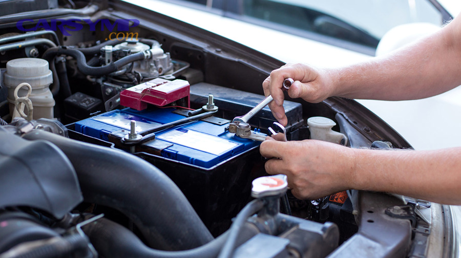 How do you remove the old battery step-by-step without causing sparks?