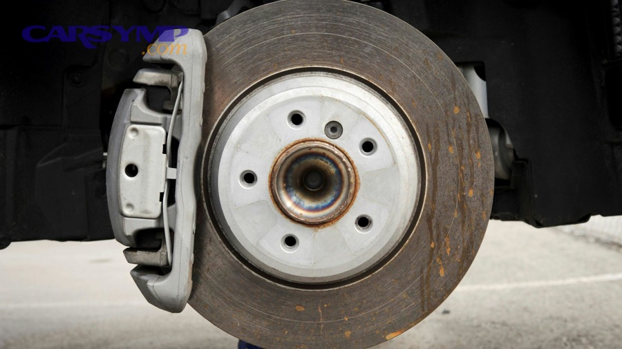How can dust, debris, and contamination create squeal after pad replacement?