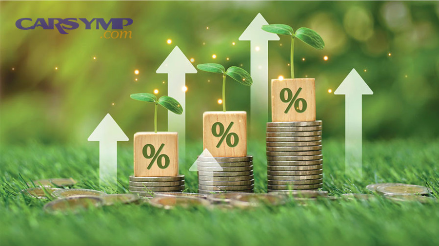 Mechanic performing car diagnostics with a scan tool and laptop