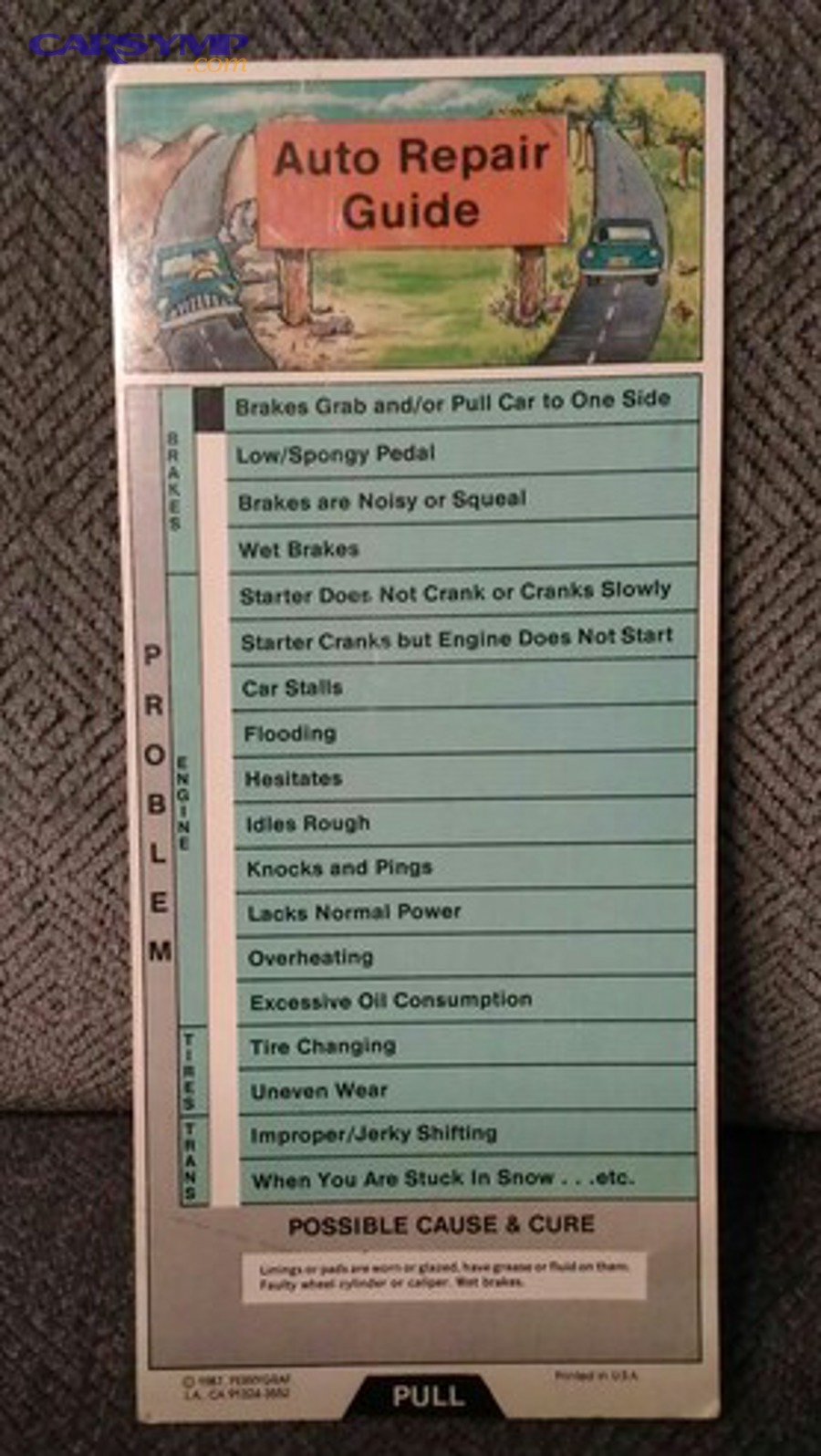 Checking oil level on a dipstick with engine bay in background