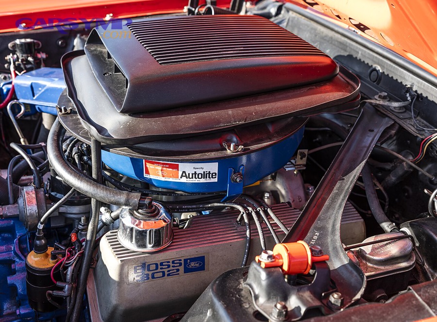 Engine bay photo showing valve covers on a V8 engine
