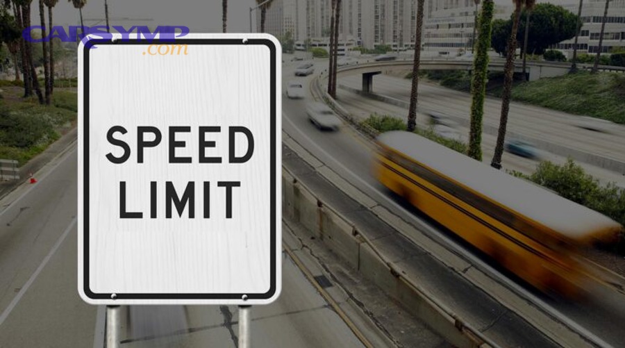 Technician working on vehicle diagnostics in a repair bay with tools and scan equipment