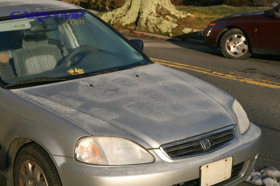 Car windshield covered with frost in winter conditions