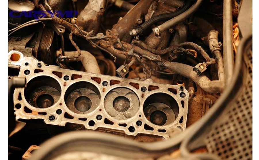 Engine fasteners being tightened evenly across a cover