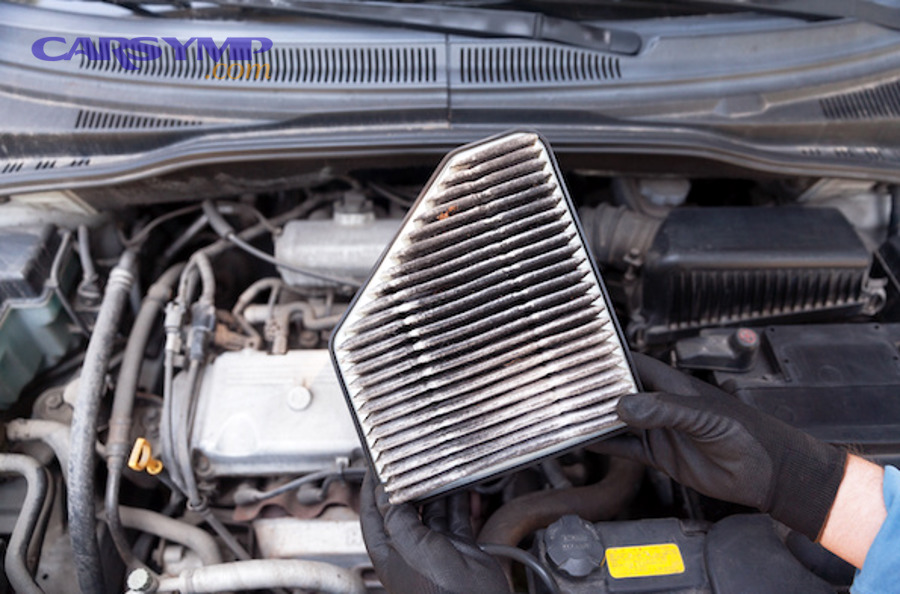 Engine air filter being removed for inspection