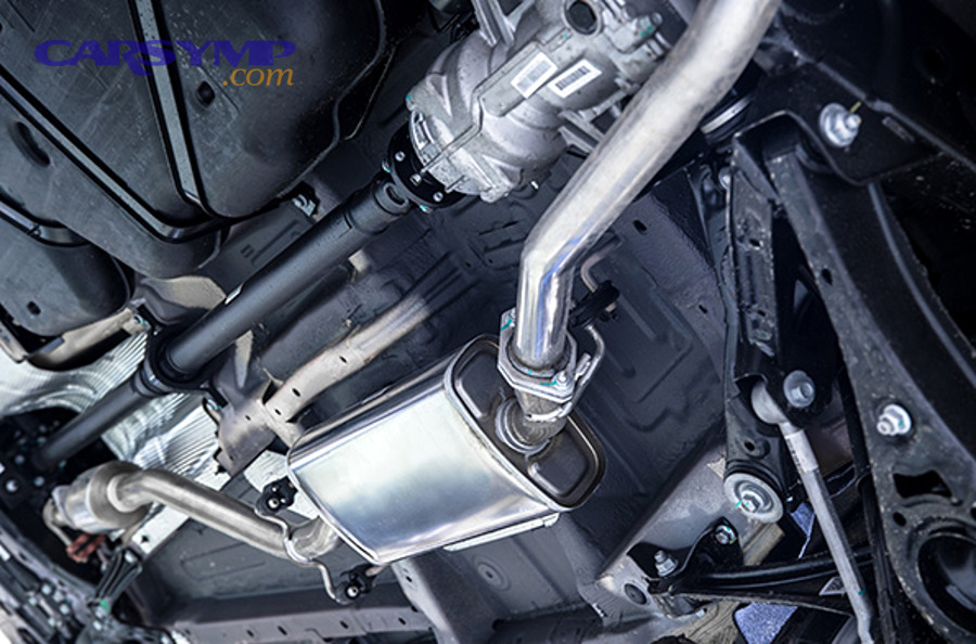 Mechanic inspecting transmission torque converter and flywheel components