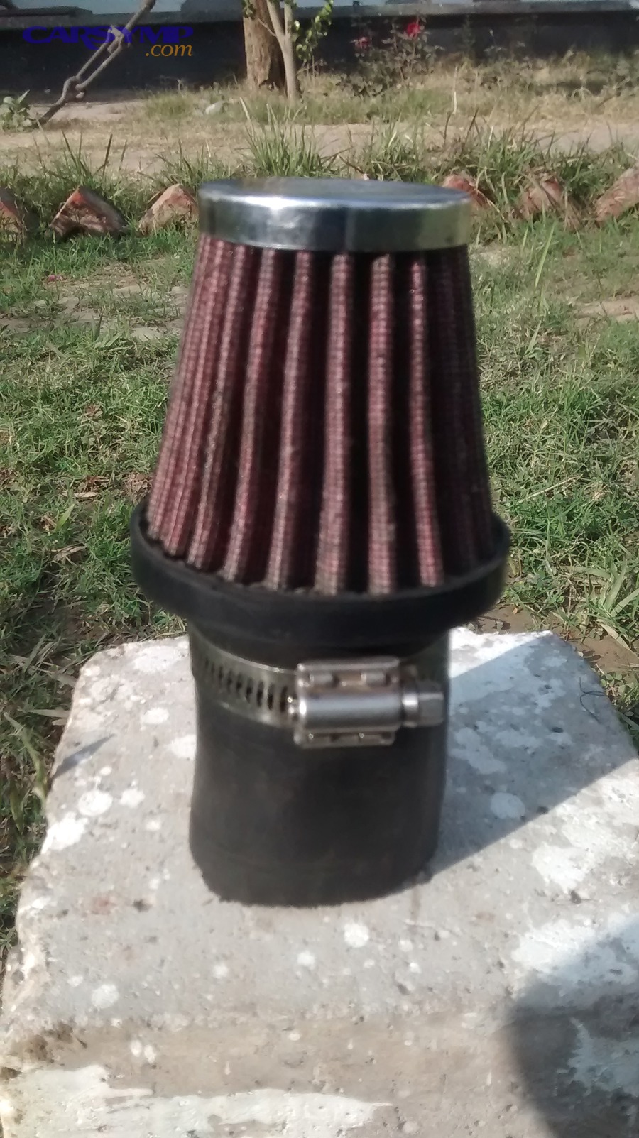 Used engine intake air filter showing dirt loading and discoloration