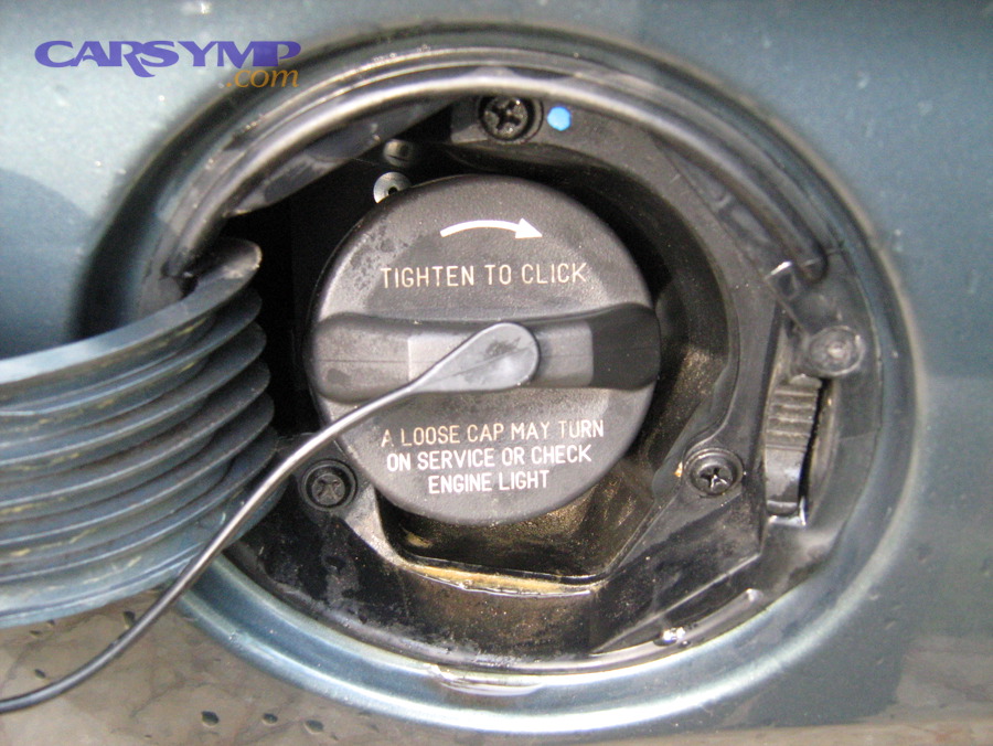Fuel filler cap with tighten-to-click warning