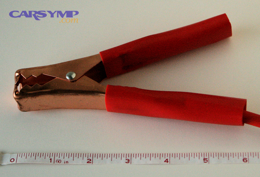 Close-up of a battery clamp connected to a terminal