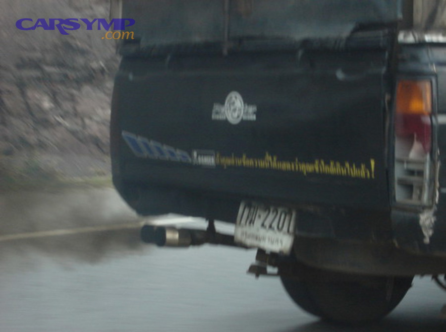 Black smoke from a vehicle exhaust indicating heavy soot and rich fueling