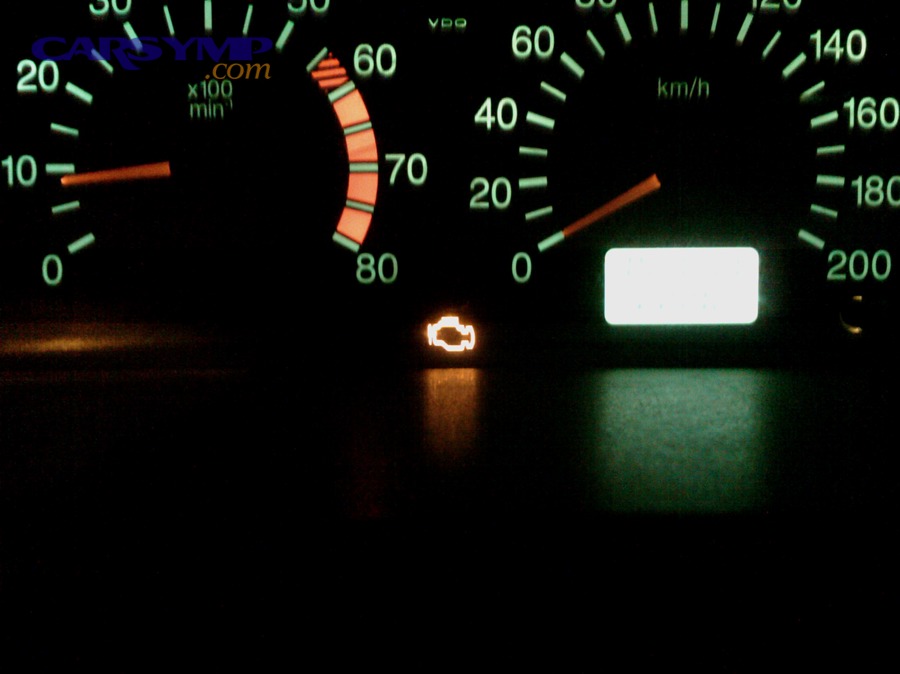 Check engine warning light illuminated on an instrument cluster