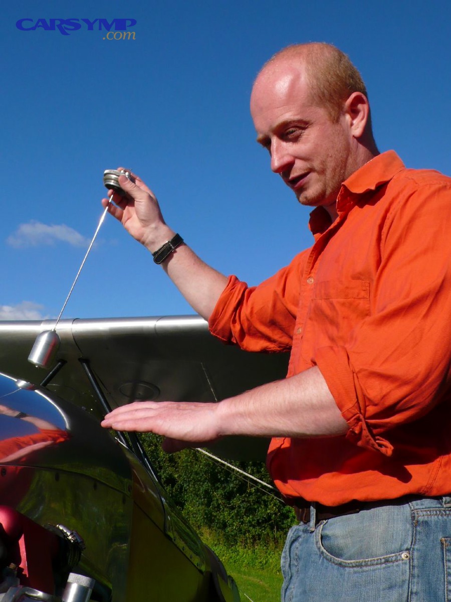 Dipstick example used to illustrate checking fluid level and condition
