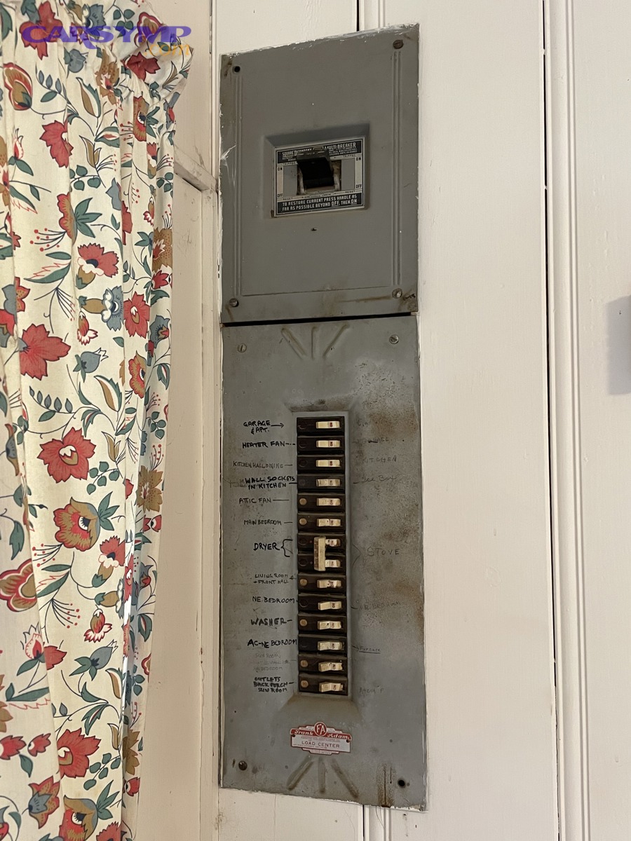 Older home electrical panels showing legacy breaker and main disconnect equipment