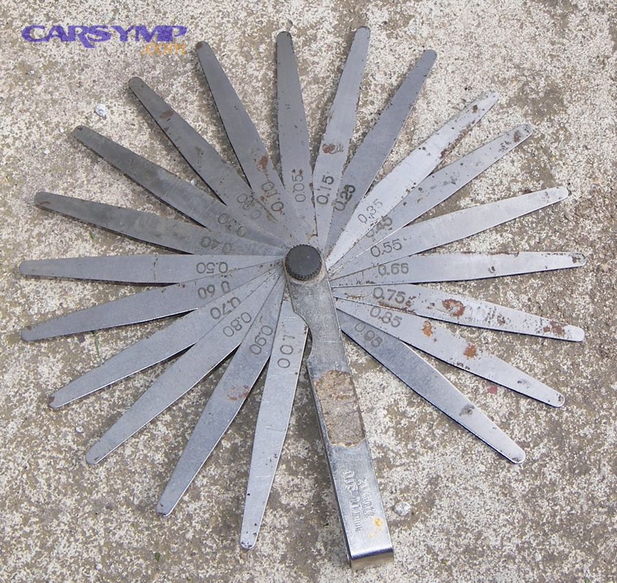 Feeler gauge used to measure small gaps when checking flatness of a sealing surface