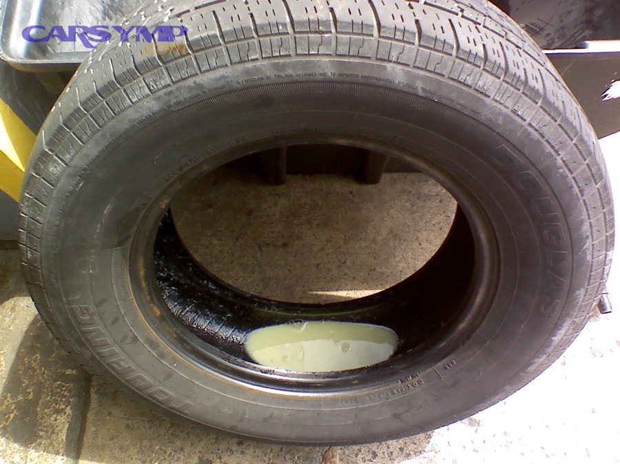 Tire sealant residue inside a tire (Fix-a-Flat example)