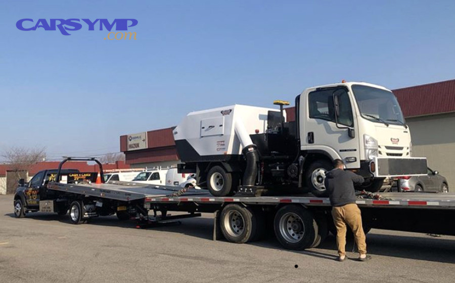 Flatbed tow truck used for safer towing in special cases such as AWD and EV vehicles