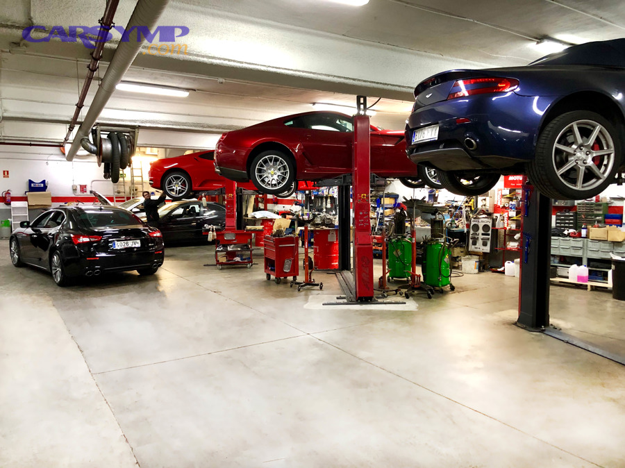 Automotive workshop photo showing bays and equipment that influence shop rates