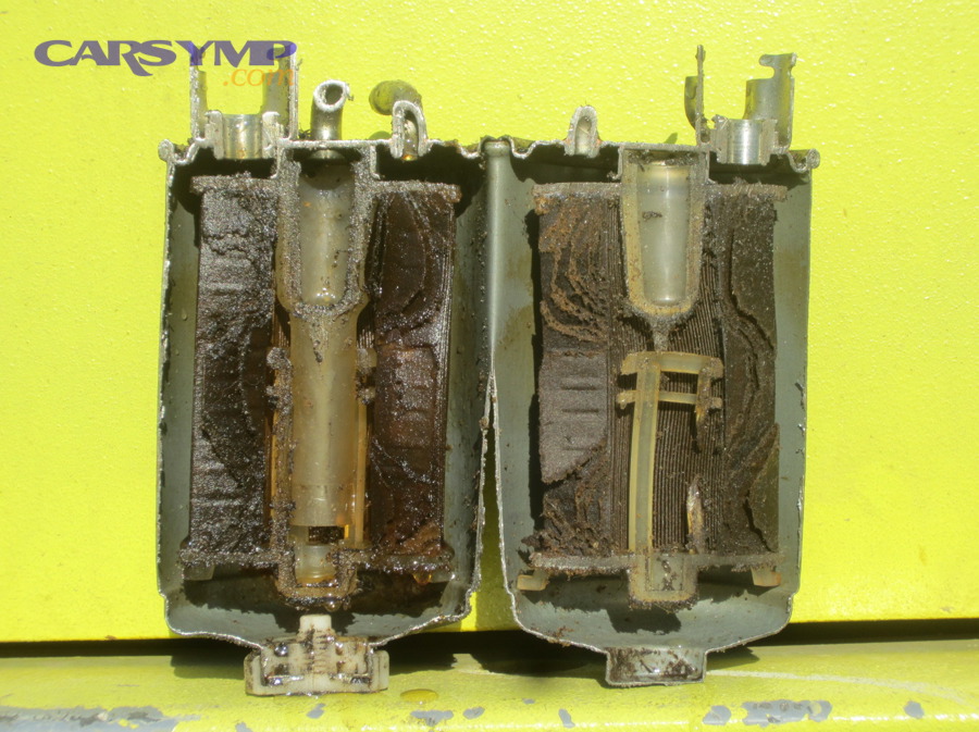 Cut-open fuel filter showing internal media and potential clogging
