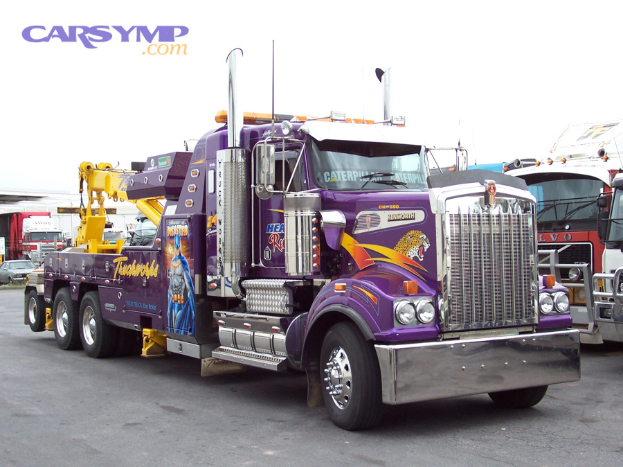Heavy tow truck illustrating towing as a safe option when gearbox noise indicates high risk