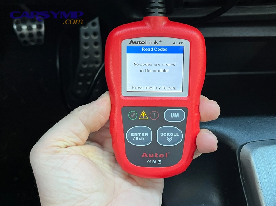 Handheld OBD2 scan tool displaying a diagnostic menu
