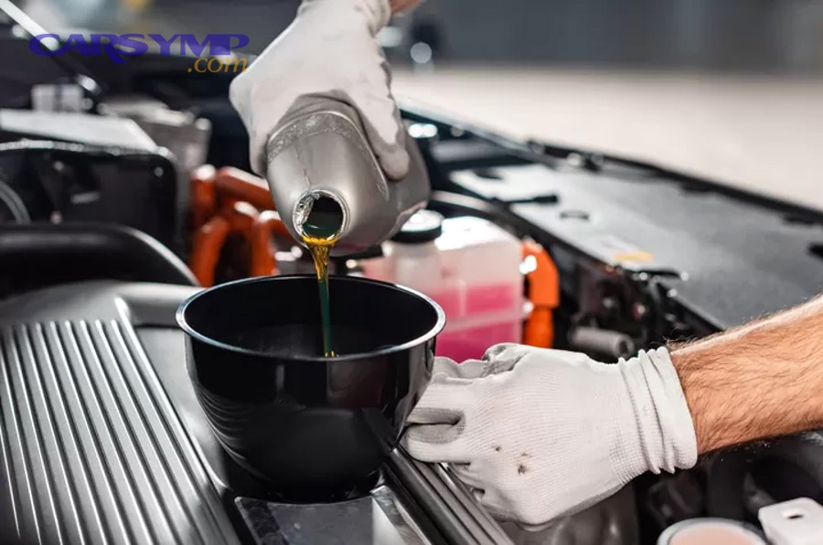Draining motor oil from a vehicle during an oil change
