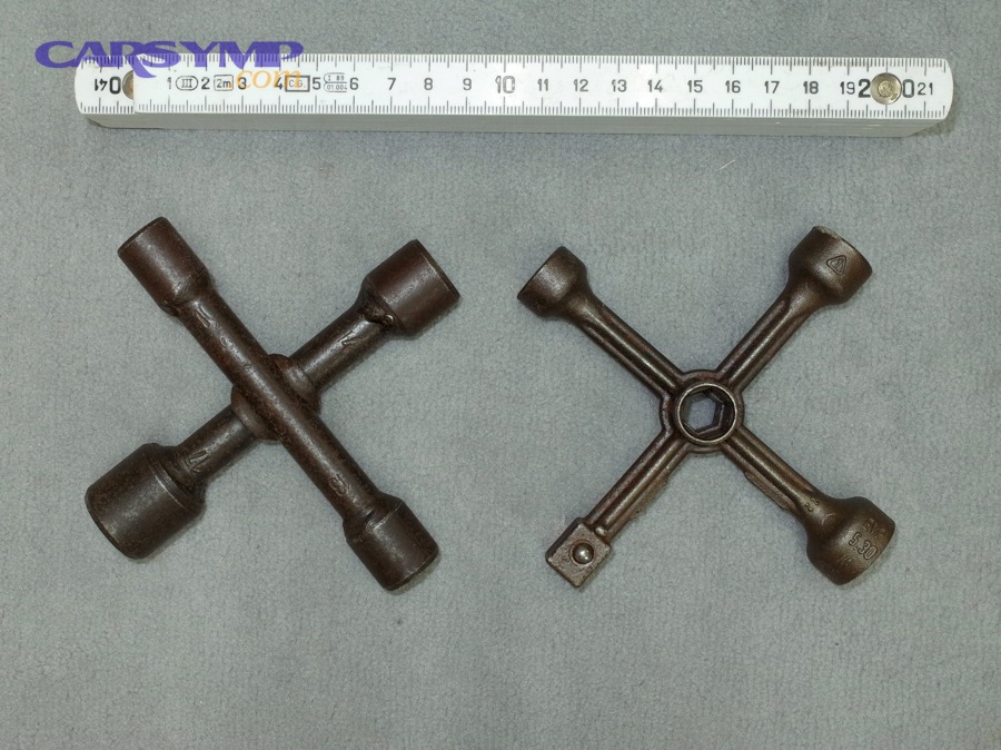 Cross-shaped lug wrench used for wheel lug nuts