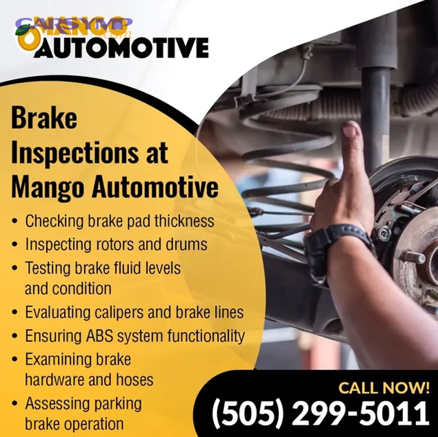 Vehicle on a lift allowing technician inspection of brakes and parking brake cables