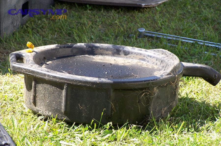Oil catch pan used to spot drips during leak checks