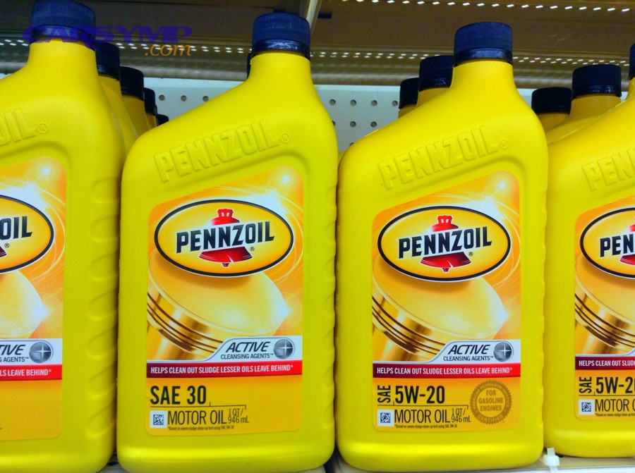 Motor oil bottles on a shelf showing different SAE grades