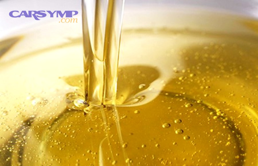 Pouring oil from a container, illustrating fluid flow and viscosity